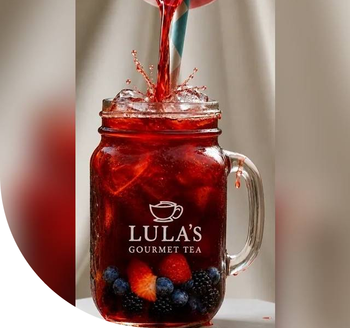 Iced berry tea in mason jar with logo